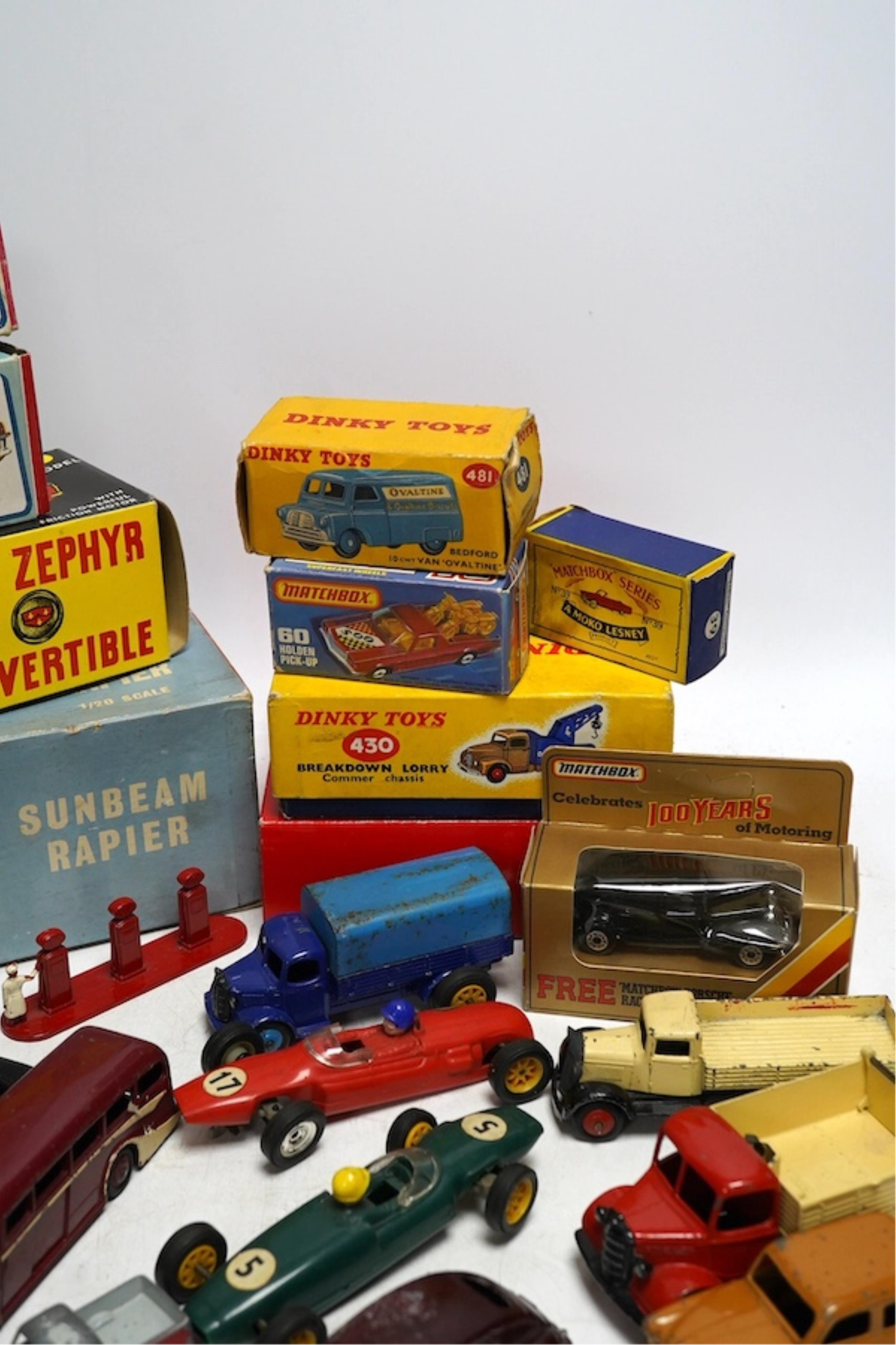 A quantity of diecast vehicles and a few useful boxes including; a boxed Clifford Series Ford Zephyr convertible, two boxed Replicar series Ford Zephyr convertibles, ten unboxed Dinky Toys, two Scalextric Formula One car